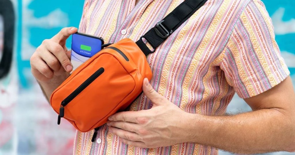 man wearing orange fanny pack