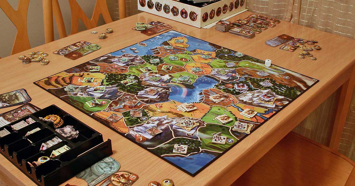 small world strategy board game set up on a table