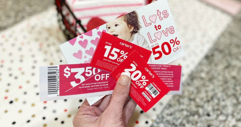 store coupons being held by a womans hand