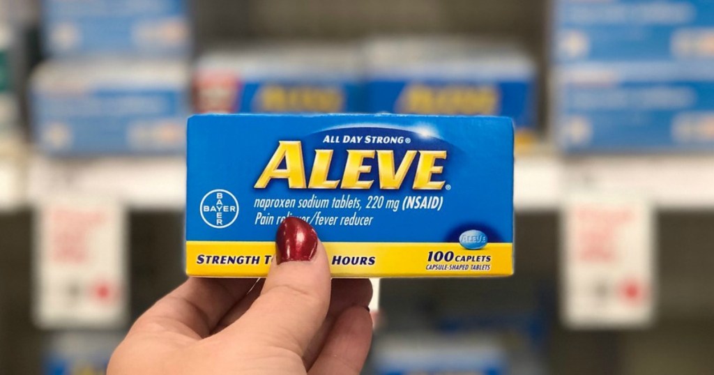 hand holding aleve caplets in a store