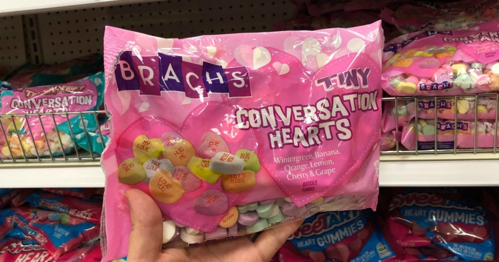 hand holding brach's conversation hearts in a store