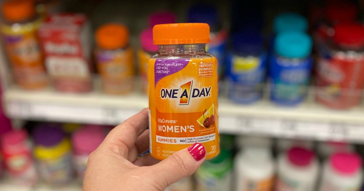 hand holding vitamins in a store