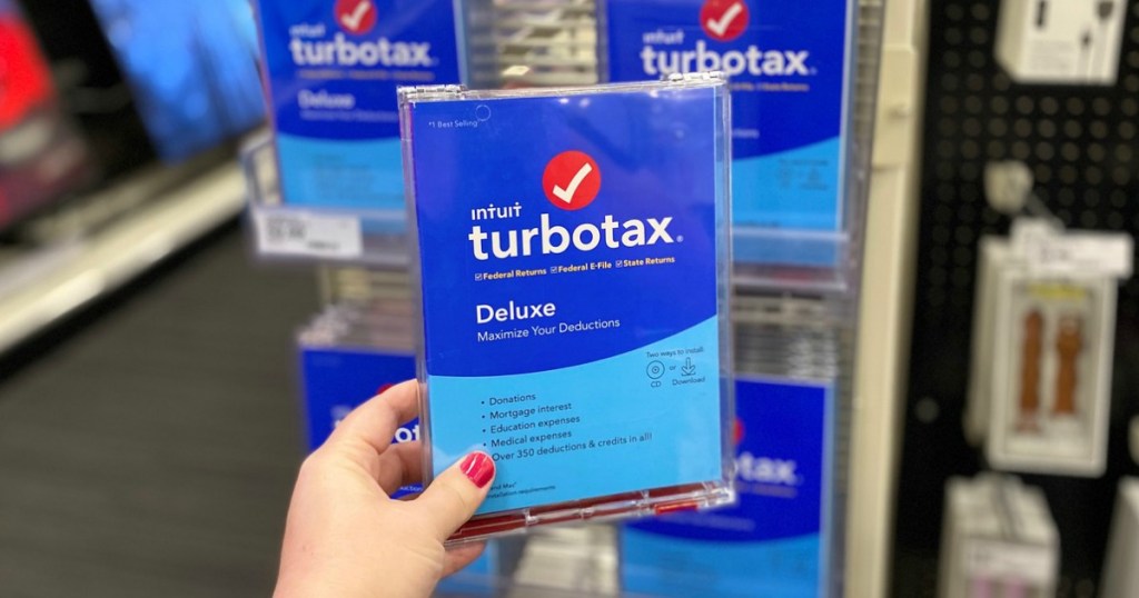 hand holding tax software in a store