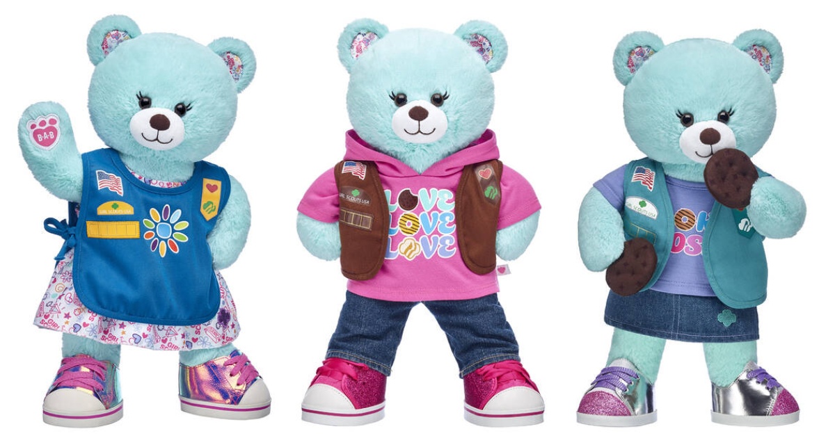 blue bear wearing 3 different Girl Scout uniforms