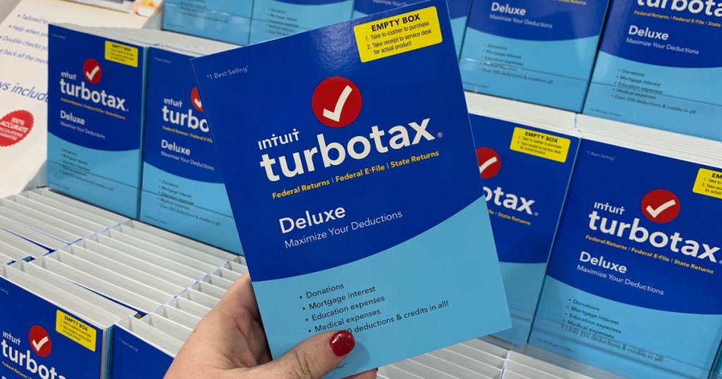 Womans hand holding turbotax