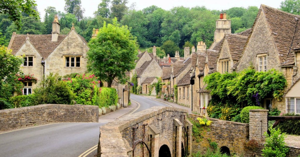 old village with brick bridge and greenery