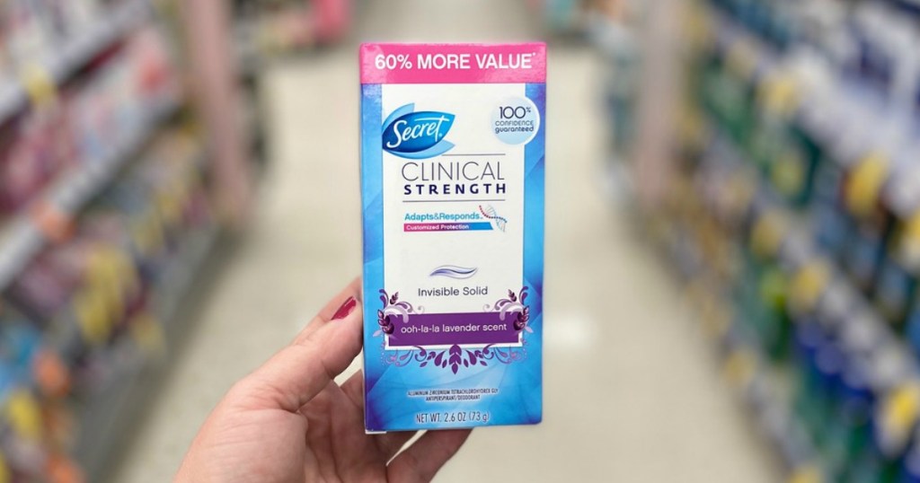 hand holding secret clinical strength deodorant in a store