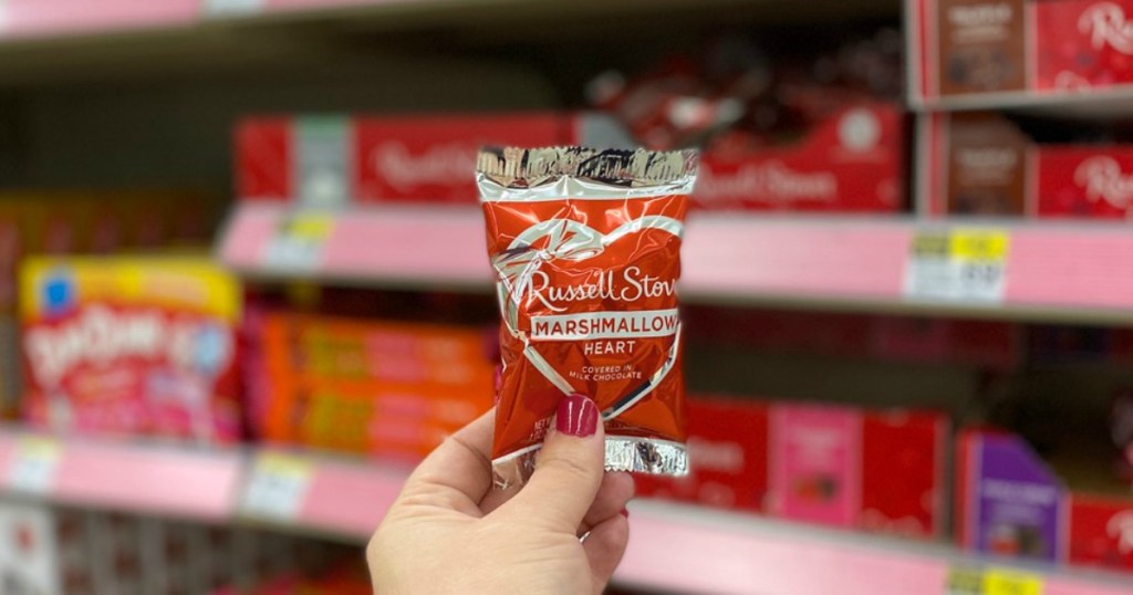 hand holding valentine's day candy in a store