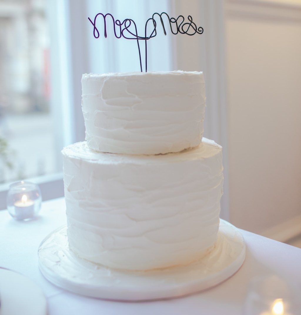 white two tier wedding cake with mr and mrs cake topper