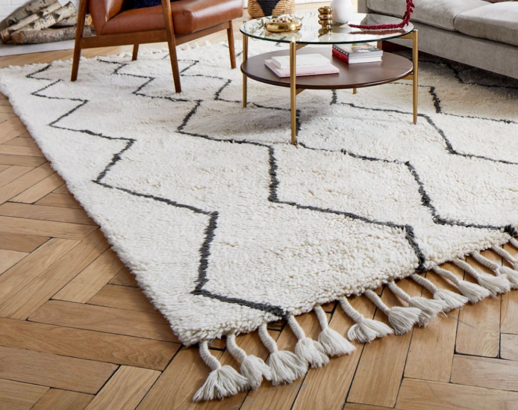 white and black shag rug on herringbone floor