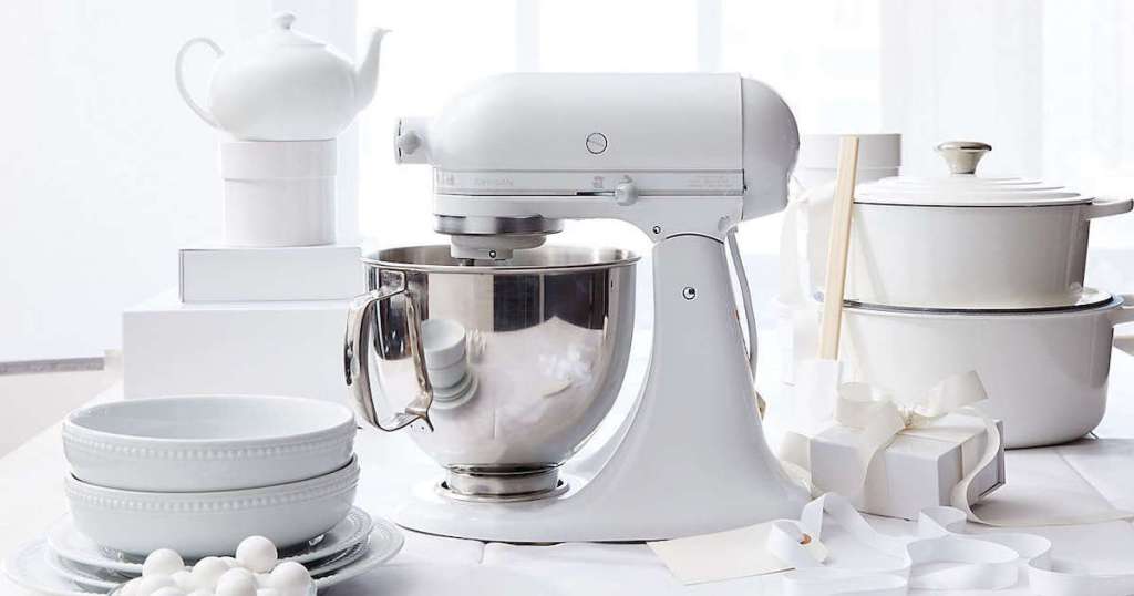 all white kitchenaid mixer with white dishes and presents from best wedding registry