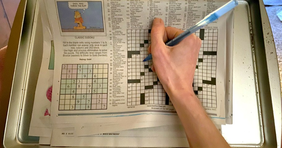 woman doing crossword puzzle as the crossword puzzle scholarship is one of the unusual, weird, obscure, and rare scholarships available to college students
