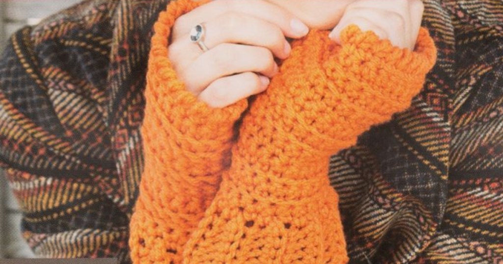 woman wearing orange crochet sleeves