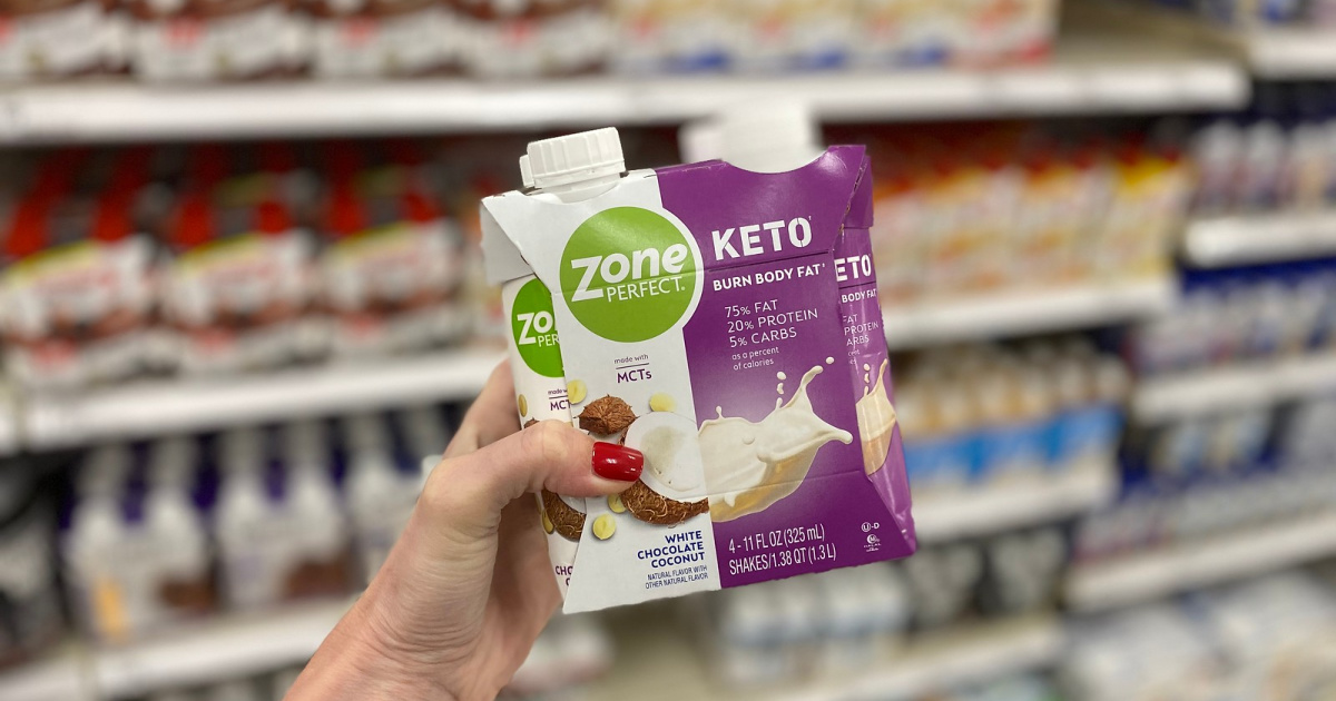 hand holding zoneperfect keto shakes 4-pack in store