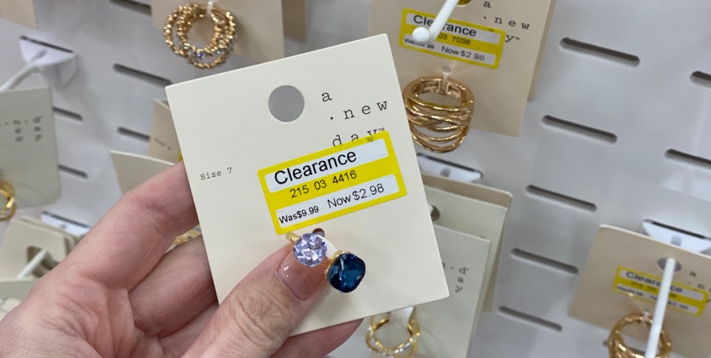 hand holding a ring with a clearance sticker