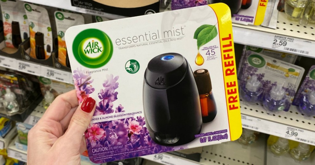 hand holding box of an Air Wick Essential Mist Kit