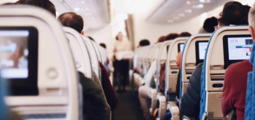 people in seats in an airplane