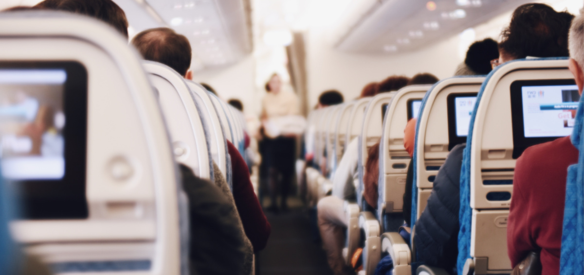 people in seats in an airplane best time to buy plane tickets