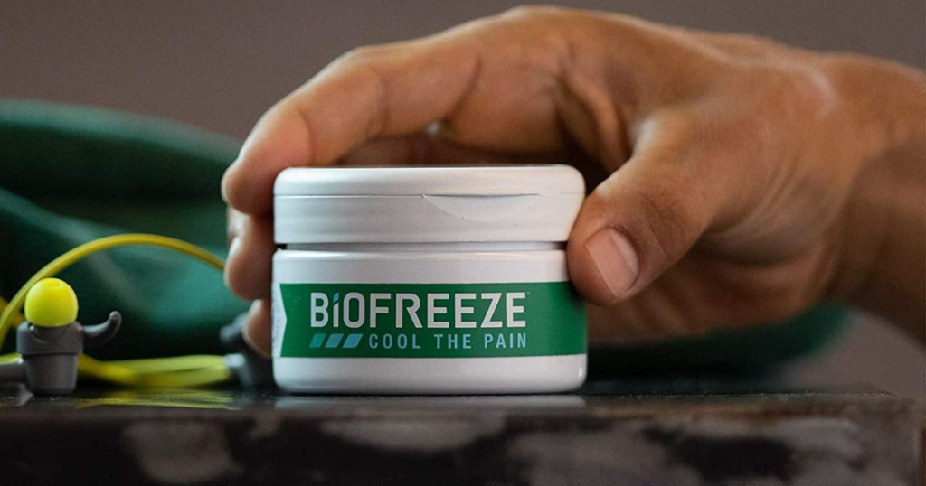 hand holding biofreeze jar