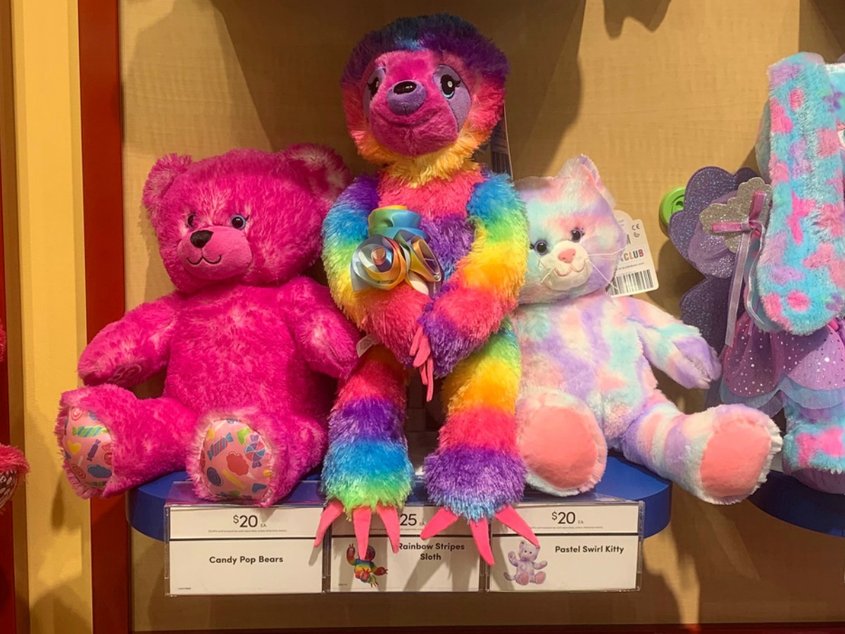 In-store display of three colorful stuffed animals