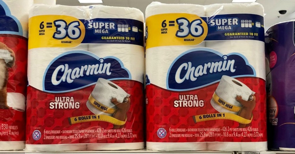 Multipacks of extra large toilet paper rolls packaged on shelf in-store