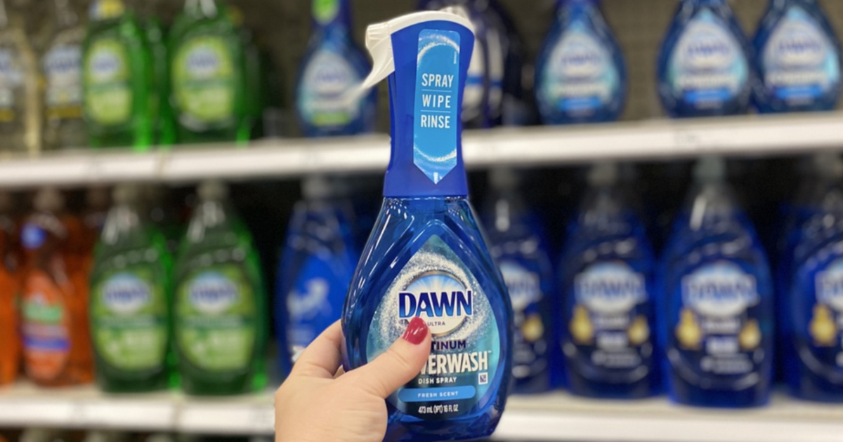 Woman's hand holding dish detergent in store aisle