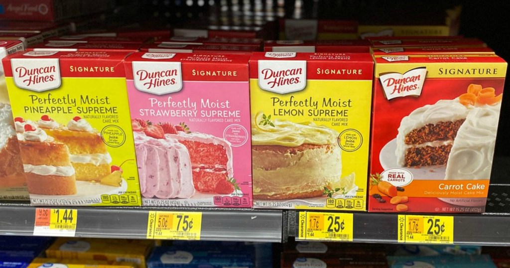 various boxes of Duncan Hines cake mix on a store shelf