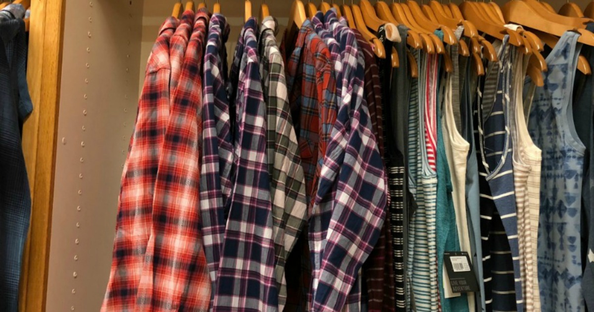 Large in-store display of women's flannel shirts on clearance