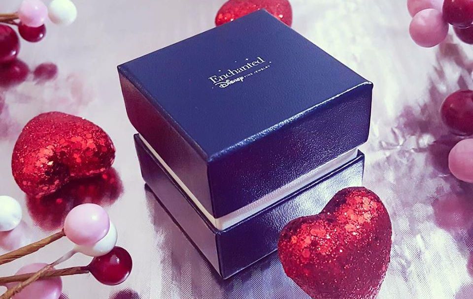 Enchanted Disney Ring Box surrounded by hearts