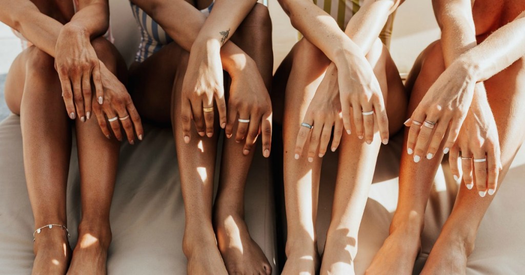 women sitting together and wearing silicone rings