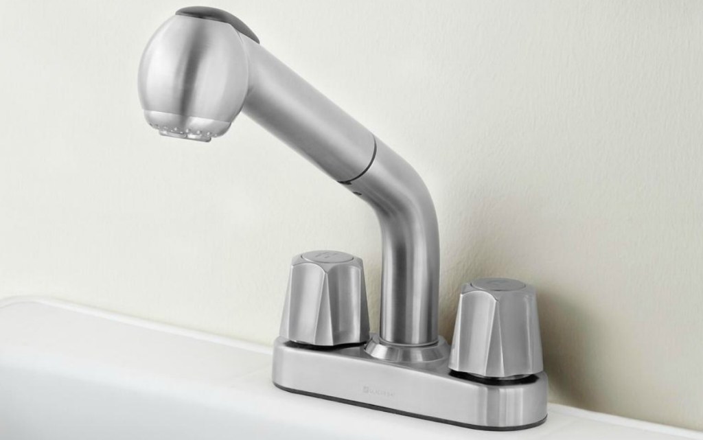 Large stainless steel faucet on sink
