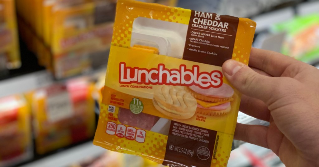 man hand holding ham and cheese lunchable in target