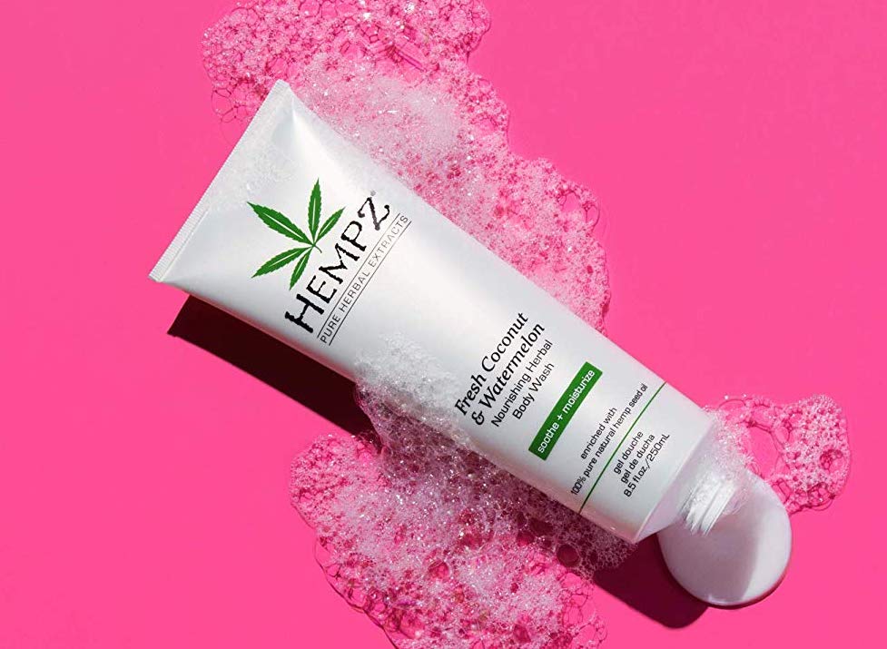 Hempz Body Wash on a pink background surrounded by bubbles