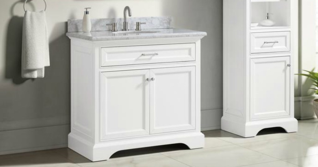 Large white bathroom vanity with marbled counter
