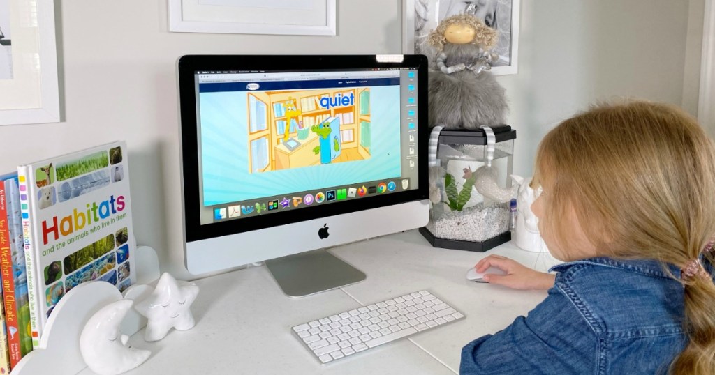 Girl playing Hooked on Phonics on Mac computer