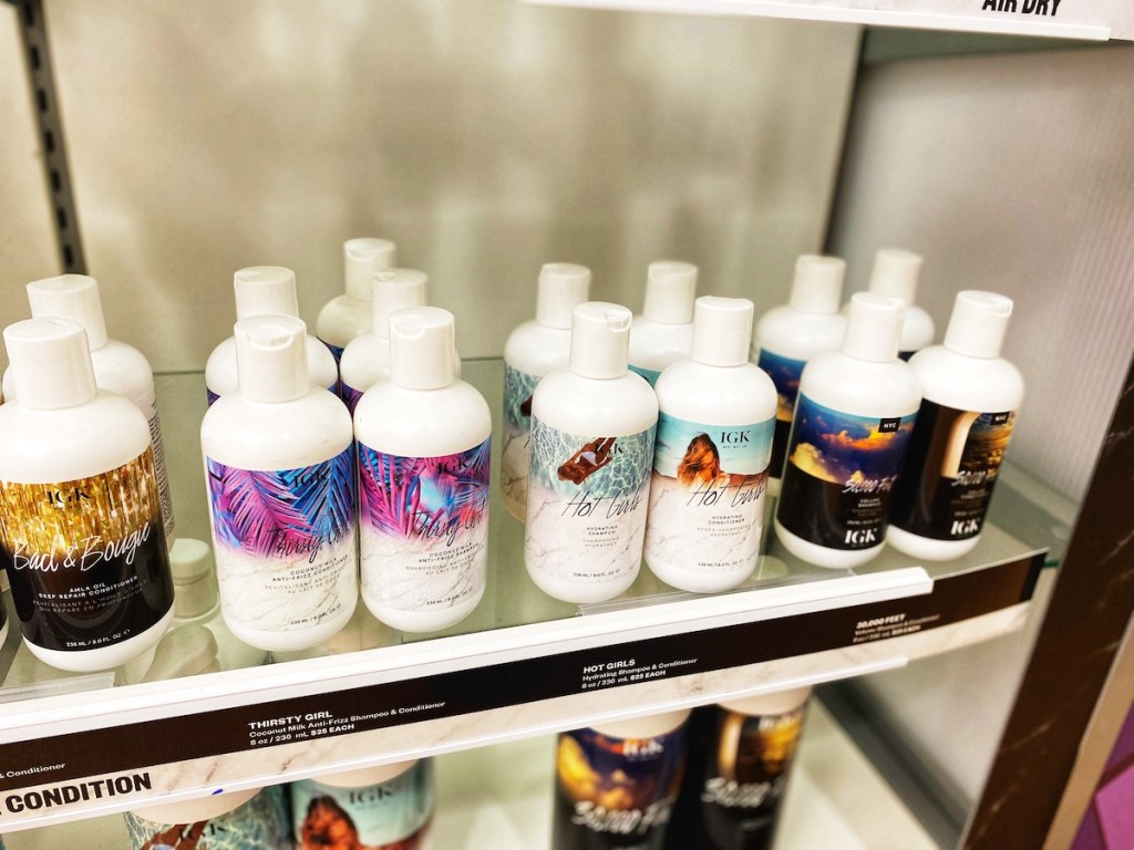 shelf with igk shampoos and conditioners