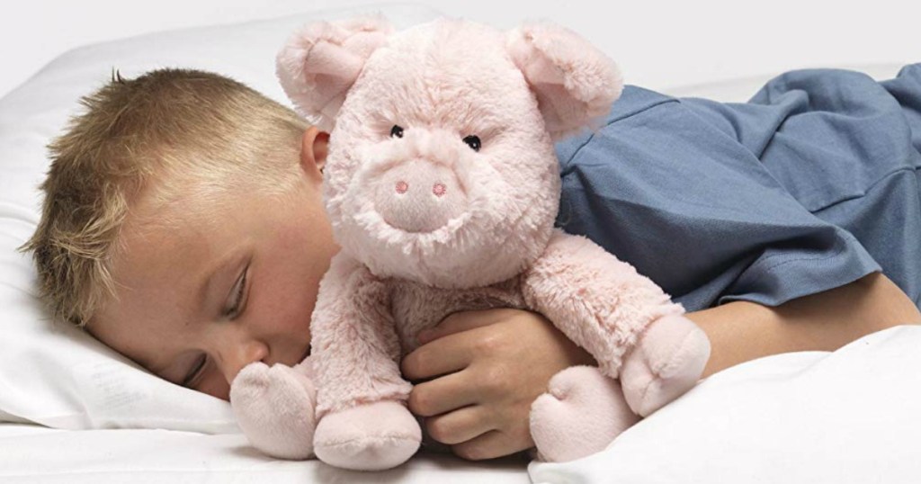 boy snuggling with a stuffed animal