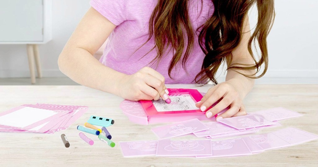 girl coloring in LOL Surprise Fashion Plates