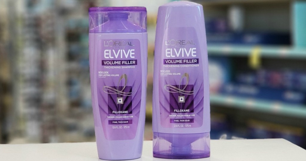 Two bottles of haircare products on counter in-store