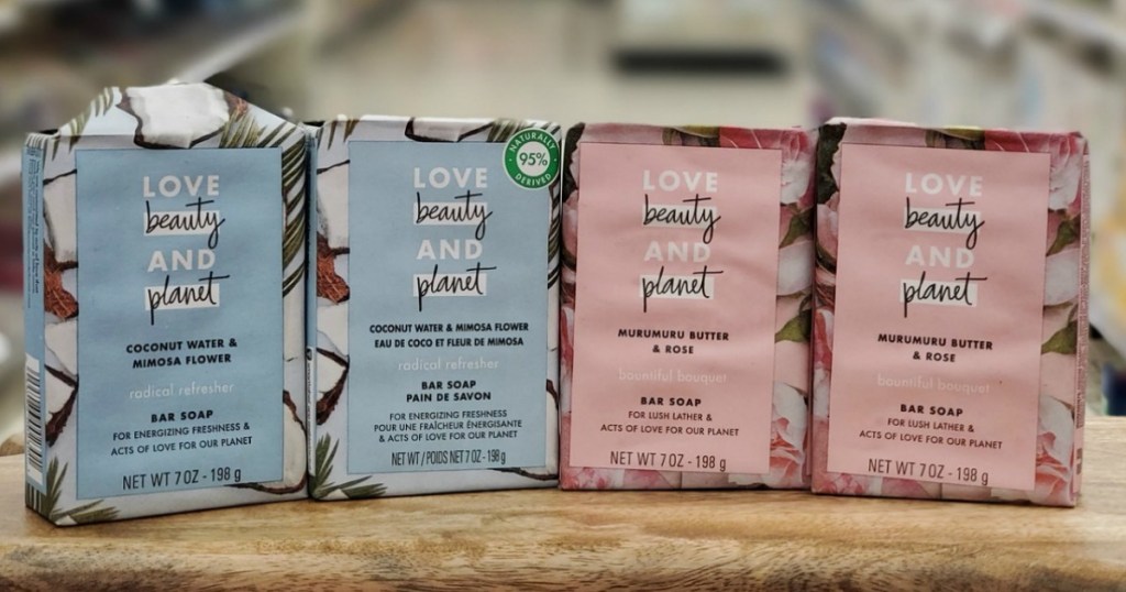 Four packages of bar soap in pink and blue on counter top