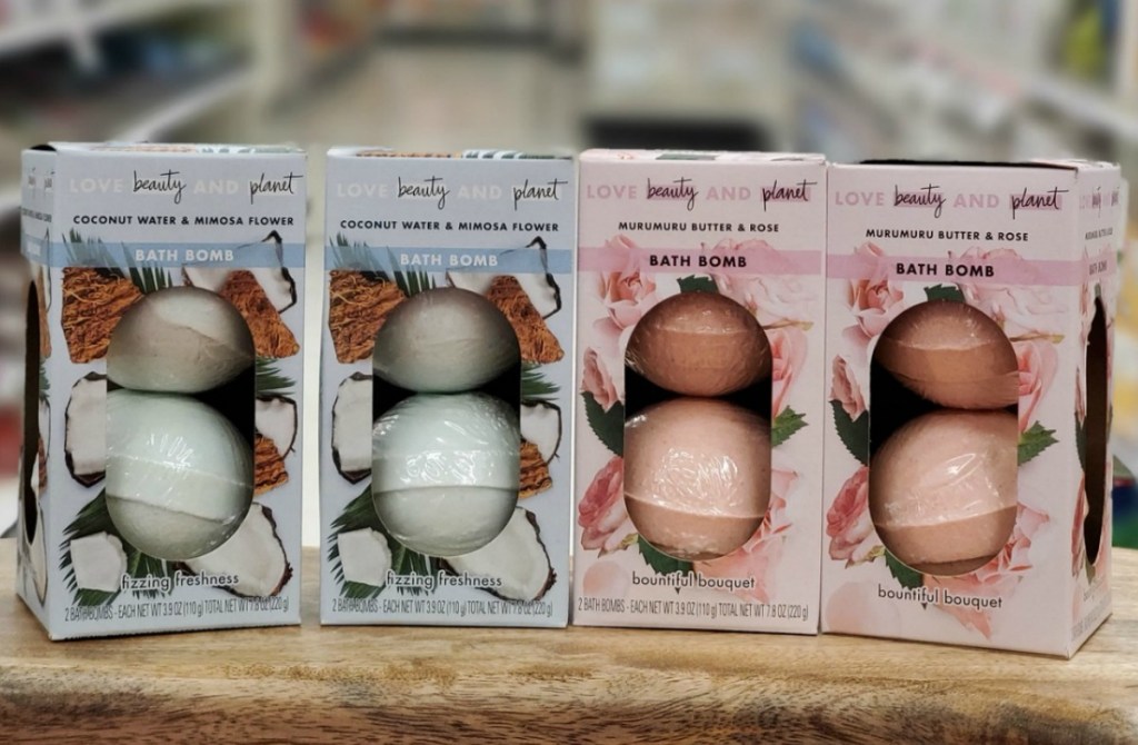 Four packages of bath bombs in pink and blue