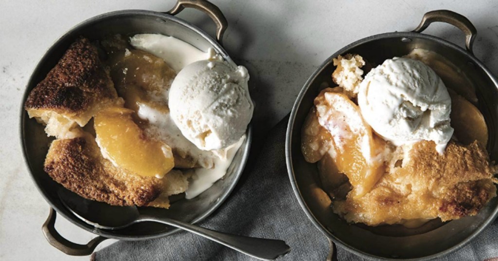 peach cobbler with ice cream in cast iron pans