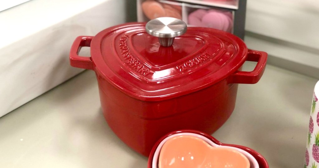 red heart shaped cooking pan with a lid