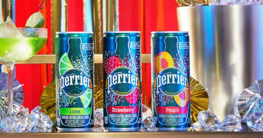 Perrier slim cans in various flavors in front of ice and a festive tablescape
