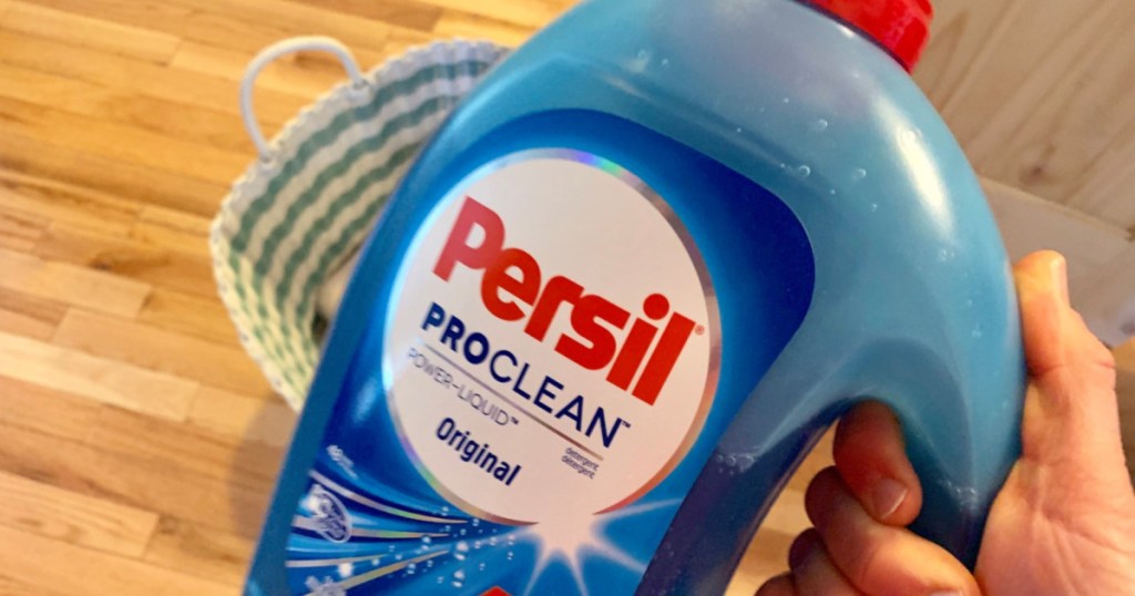 hand holding bottle of persil proclean liquid laundry detergent