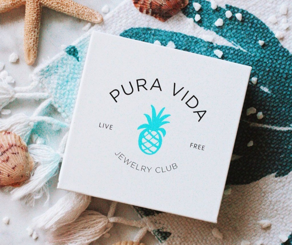 Pura Vida Jewelry Club box surrounded by seashells