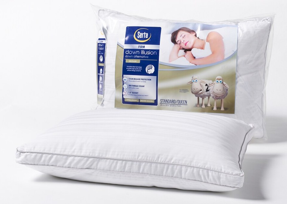 Serta down pillow laying next to pillow in package