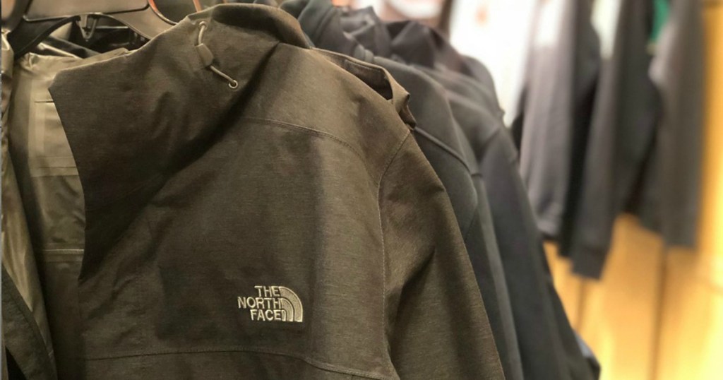 rain jackets hanging up in a store