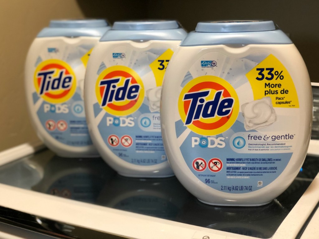 3 containers of Tide Pods Free & Gentle on washing machine
