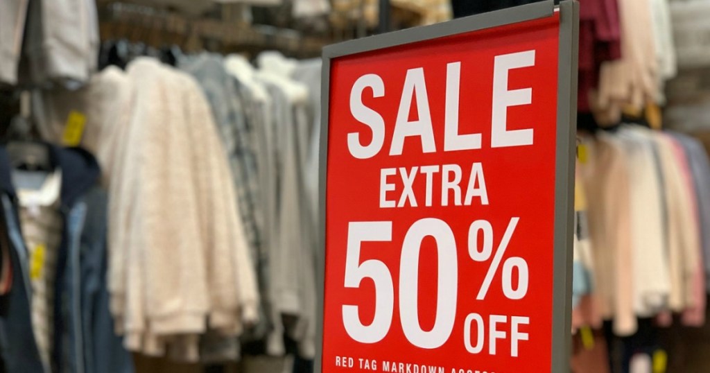 Large Sale sign for 50% off on display in-store